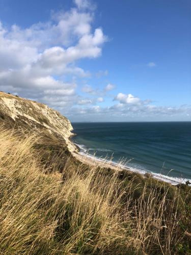 a view of the ocean from a bluff at Purbeck Hill View in Swanage