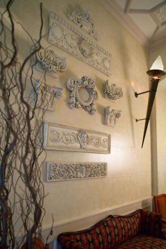a room with a wall with decorations on it at The Midland Hotel in Bradford