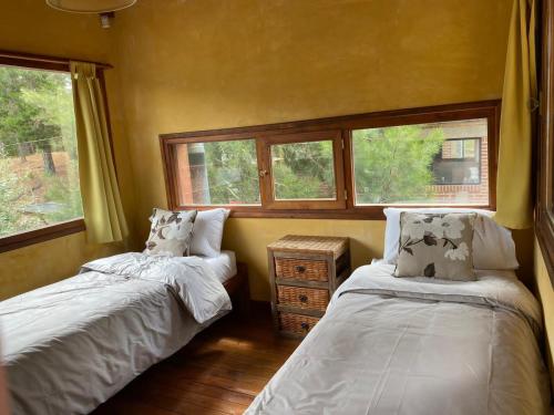 Una cama o camas en una habitación de Cabañas Los Castores
