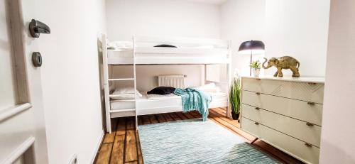 a bedroom with bunk beds and a mirror at City Vibe in Brčko