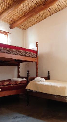 Ένα ή περισσότερα κρεβάτια σε δωμάτιο στο El Sol Hostel de Humahuaca