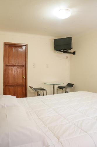 Televisor o centre d'entreteniment de Hostal Chasky