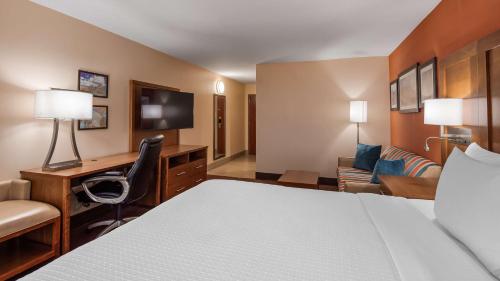 a hotel room with a bed and a desk at Best Western Cannon A.F.B. in Clovis