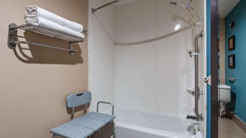 a bathroom with a tub and a shower and a sink at Best Western Cannon A.F.B. in Clovis
