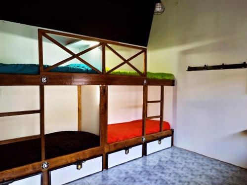 a couple of bunk beds in a room at Hostel de la Plaza in Miramar