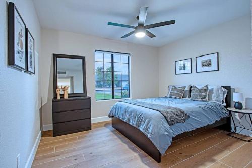 a bedroom with a bed and a ceiling fan at ESTRELLA - Renovated with PATIO, BBQ, POOL & SPA in Chandler