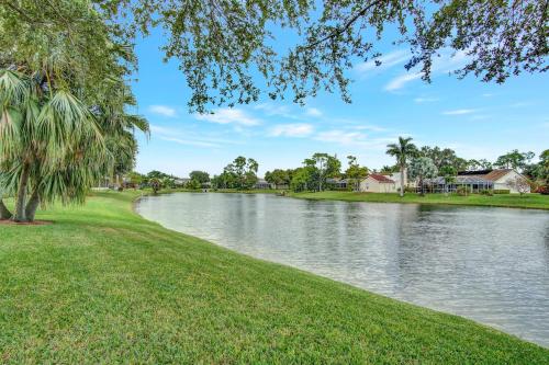 a river with trees and houses in the distance at SUPERB VILLA WITH PRIVATE POOL IN NAPLES in Naples