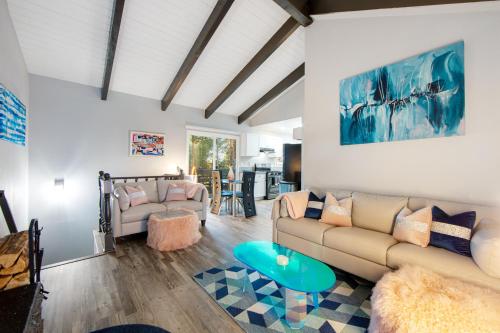 a living room with a couch and a table at Arrowhead Aerie in Lake Arrowhead