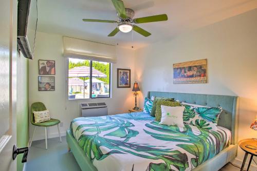 a bedroom with a bed and a ceiling fan at Vibrant Apt with Saltwater Pool - 3 Mi to Dtwn! in Palm Springs