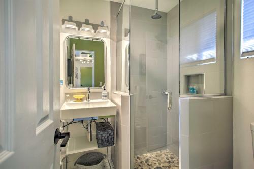 a bathroom with a sink and a shower with a mirror at Vibrant Apt with Saltwater Pool - 3 Mi to Dtwn! in Palm Springs