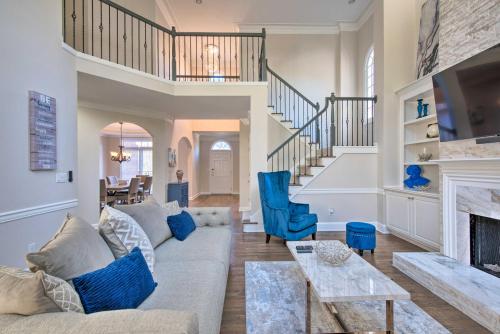 a living room with a couch and a fireplace at Updated Mableton Home about 14 Miles to Downtown ATL! in Mableton