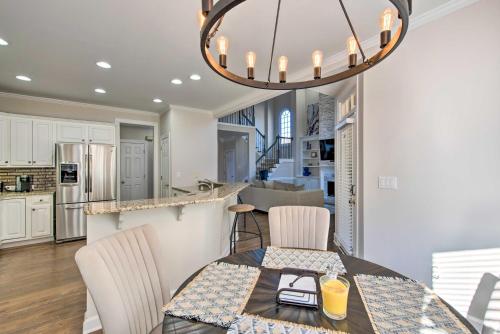 a kitchen and dining room with a table and chairs at Updated Mableton Home about 14 Miles to Downtown ATL! in Mableton