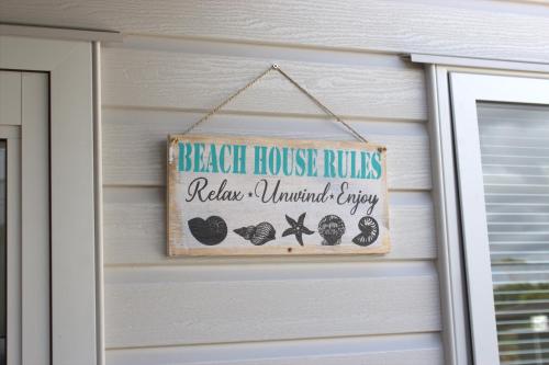 Ein Zertifikat, Auszeichnung, Logo oder anderes Dokument, das in der Unterkunft Orewa Kiwi Cabins ausgestellt ist