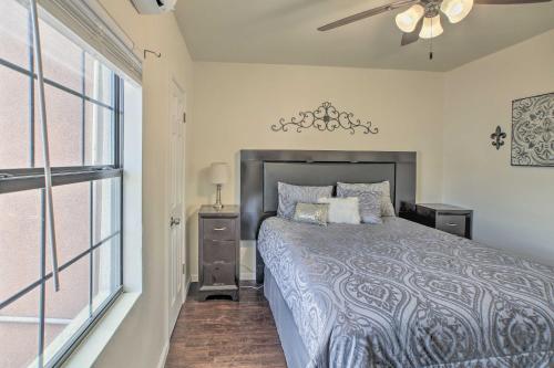a bedroom with a bed and a ceiling fan at Quaint Roswell Retreat about 1 Mi to Main Street! in Roswell