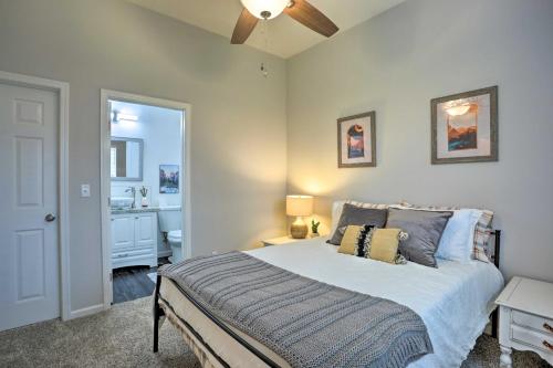 a bedroom with a bed and a bathroom at Stunning Clovis Home about 1 Mile to Old Town! in Clovis