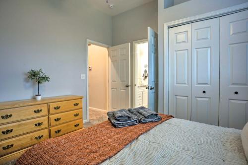 a bedroom with a bed with a dresser and a mirror at Stunning Clovis Home about 1 Mile to Old Town! in Clovis