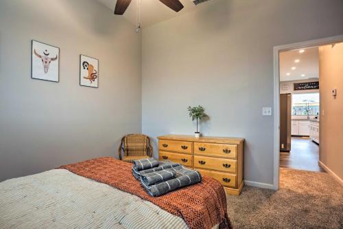 a bedroom with a large bed and a dresser at Stunning Clovis Home about 1 Mile to Old Town! in Clovis