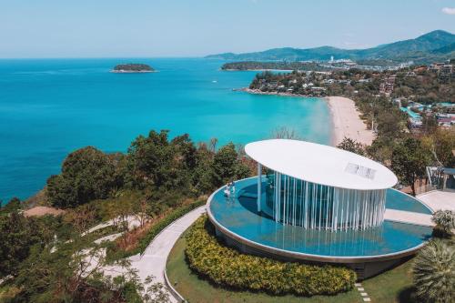 an aerial view of a building next to a beach at The Shore At Katathani - Adult Only - SHA Extra Plus in Kata Beach