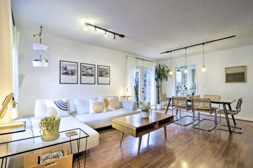 a living room with a couch and a table at Home with Outdoor Oasis in Downtown Raleigh! in Raleigh