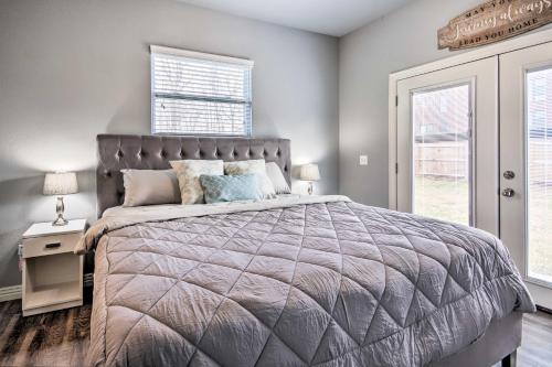 a bedroom with a large bed and a window at Home Grassy Yard, Walk to Bentonville Square in Bentonville