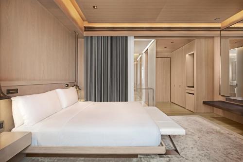 a bedroom with a large white bed in a room at Hyatt Centric Levent Istanbul in Istanbul