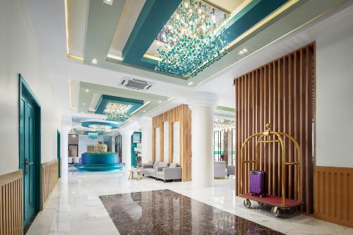 a lobby with a luggage cart in the middle of a room at Vakara Hotel Kep in Kep