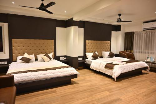 Tempat tidur dalam kamar di Mysore Royale