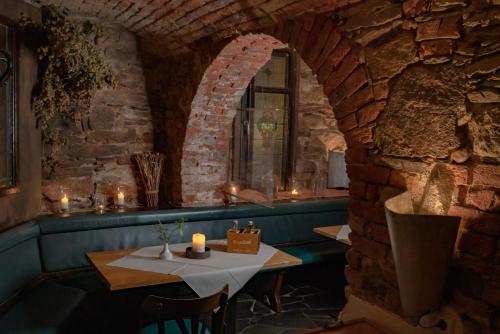 a room with a table and a window with candles at Hotel Blauer Engel in Aue