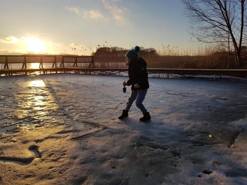 a person walking on the ice in the snow at Łap Las Pelnik in Pelnik