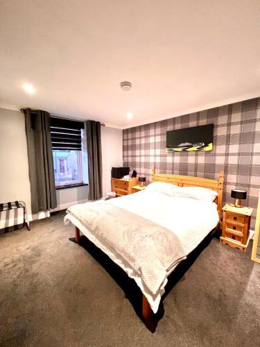 Ένα ή περισσότερα κρεβάτια σε δωμάτιο στο MacArthur House Bed & Breakfast NC500