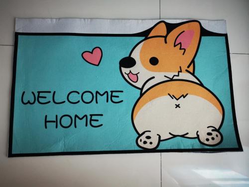 a welcome home sign with a dog at 48 悠之处NO . 48, PERSIARAN ALAM IMPIAN 3 VILLA RIADAH ALAM IMPIAN PANGKOR, 32300 PANGKOR , PERAK. in Pangkor
