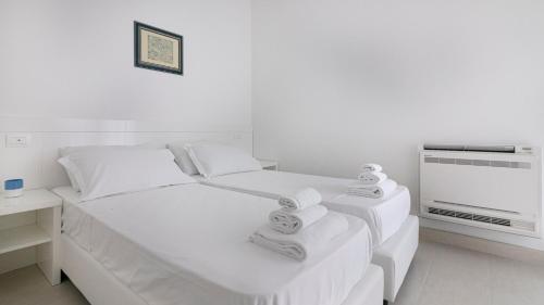 Ένα ή περισσότερα κρεβάτια σε δωμάτιο στο Rivazzurra Homes - C