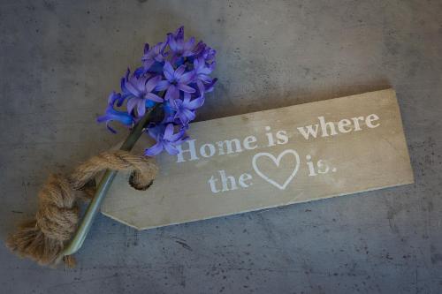 a sign that says home is where the heart is at Berghoamat Nauders in Nauders