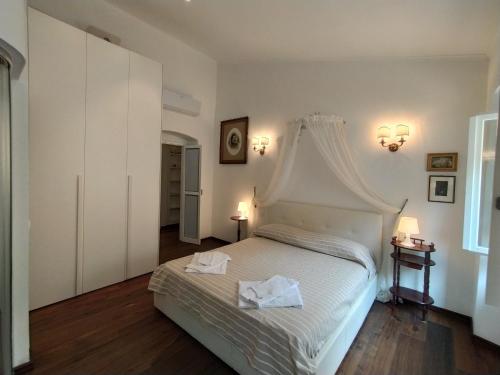 Postel nebo postele na pokoji v ubytování Casa Mantegna