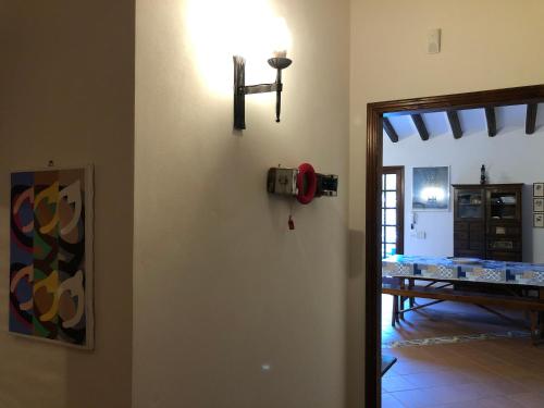 a room with a fire hydrant on the wall at Villa Mariza in Scopello
