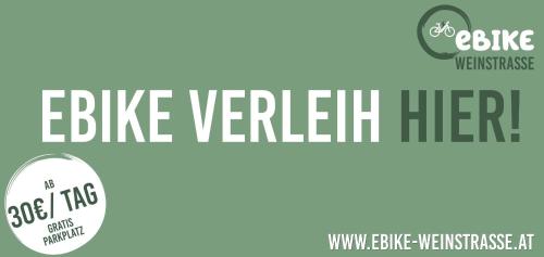 a banner with the text bike verrett her in white and green at KIRCHENWIRT an der Weinstrasse - Boutique Hotel in Ehrenhausen
