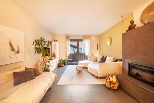 a living room with a couch and a fireplace at Lieblingsplatzl in Naturno