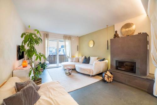 a living room with a couch and a fireplace at Lieblingsplatzl in Naturno
