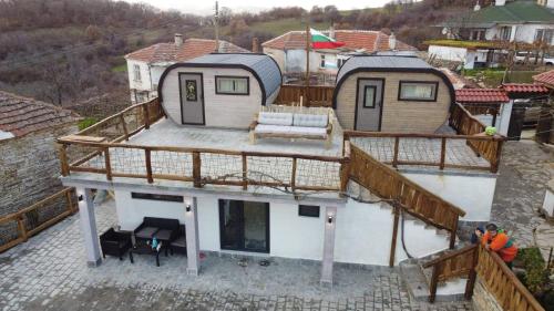 an image of a house with a deck at Namaste къща в село Камилски дол in Kamilski Dol