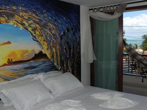 En eller flere senger på et rom på Pipa Arara House - Por Pipa Casas de Praia