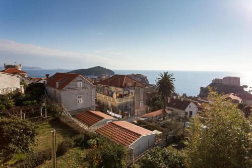 a city with houses and the ocean in the background at Apartment Art Dubrovnik in Dubrovnik