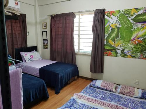 Postel nebo postele na pokoji v ubytování D'Hartamas Guesthouse