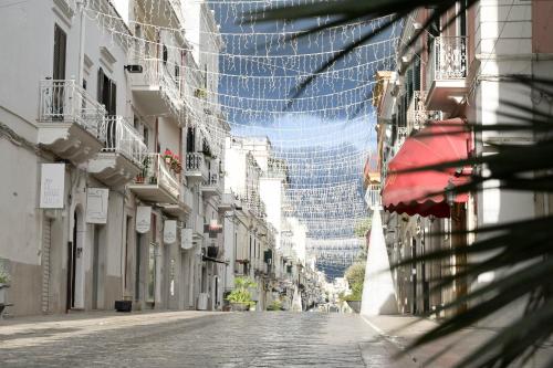 an empty street with a building in the background at B&B Orchidea Celeste in Manfredonia