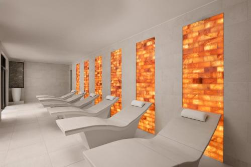 a row of white chairs in a waiting room at Fairmont Windsor Park in Windsor