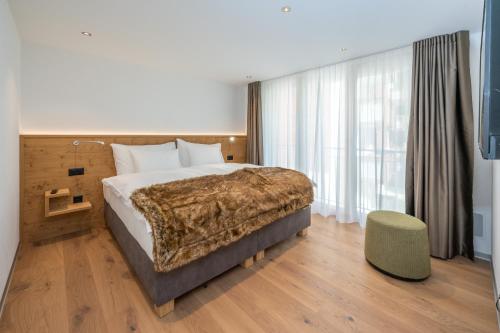 Postel nebo postele na pokoji v ubytování Luxury Residence Colosseo Zermatt