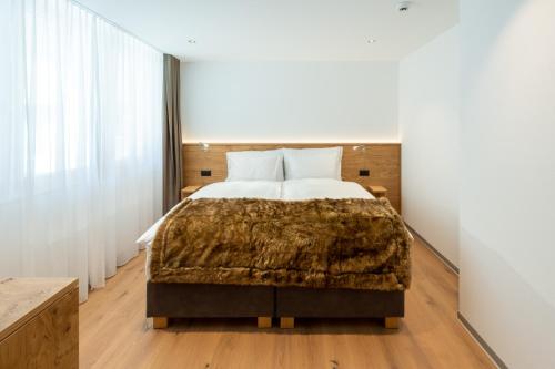 Postel nebo postele na pokoji v ubytování Luxury Residence Colosseo Zermatt