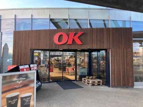 a store with a sign on the front of it at Motel Trafikcenter Sæby in Sæby