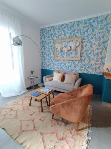 a living room with a couch and a table at MAJU Concept House - Beja Centro Histórico in Beja
