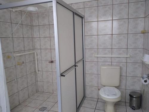 a bathroom with a shower and a toilet in it at Hotel Paraiso in Santa Maria