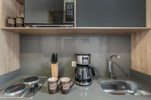 Küche/Küchenzeile in der Unterkunft Apartamentos Go Living & Suites by HOUSY HOST